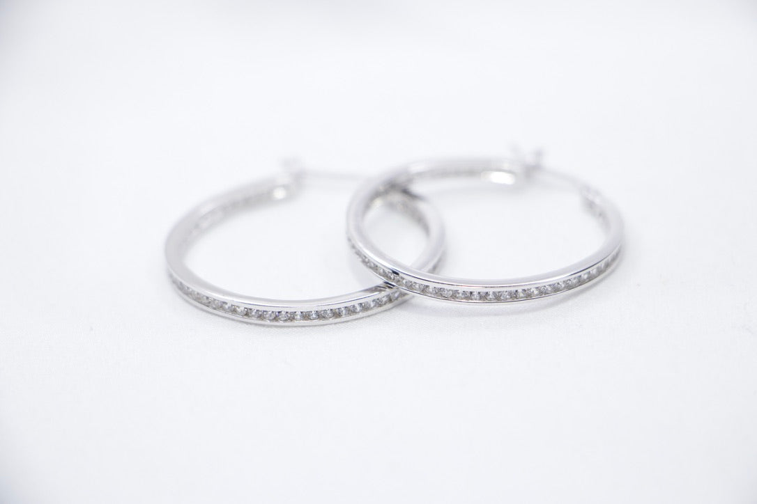 Sterling Silver Hoop Earrings with Cubic Zirconia - Elegant, Hypoallergenic Jewelry for Women front view.
