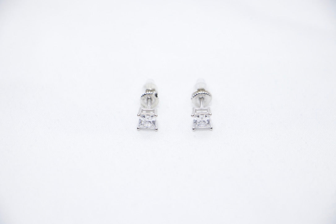 A Radiant Luxe Stud Earrings featuring a rectangular-cut cubic zirconia set in sterling silver, offering a modern and radiant look, front view.