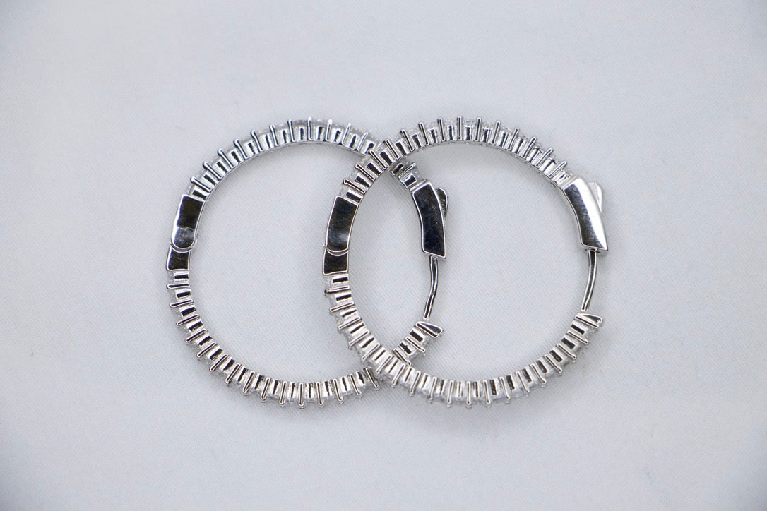 Sparkling Silver Hoop Earrings with Cubic Zirconia - Glamorous Statement Jewelry for Women.