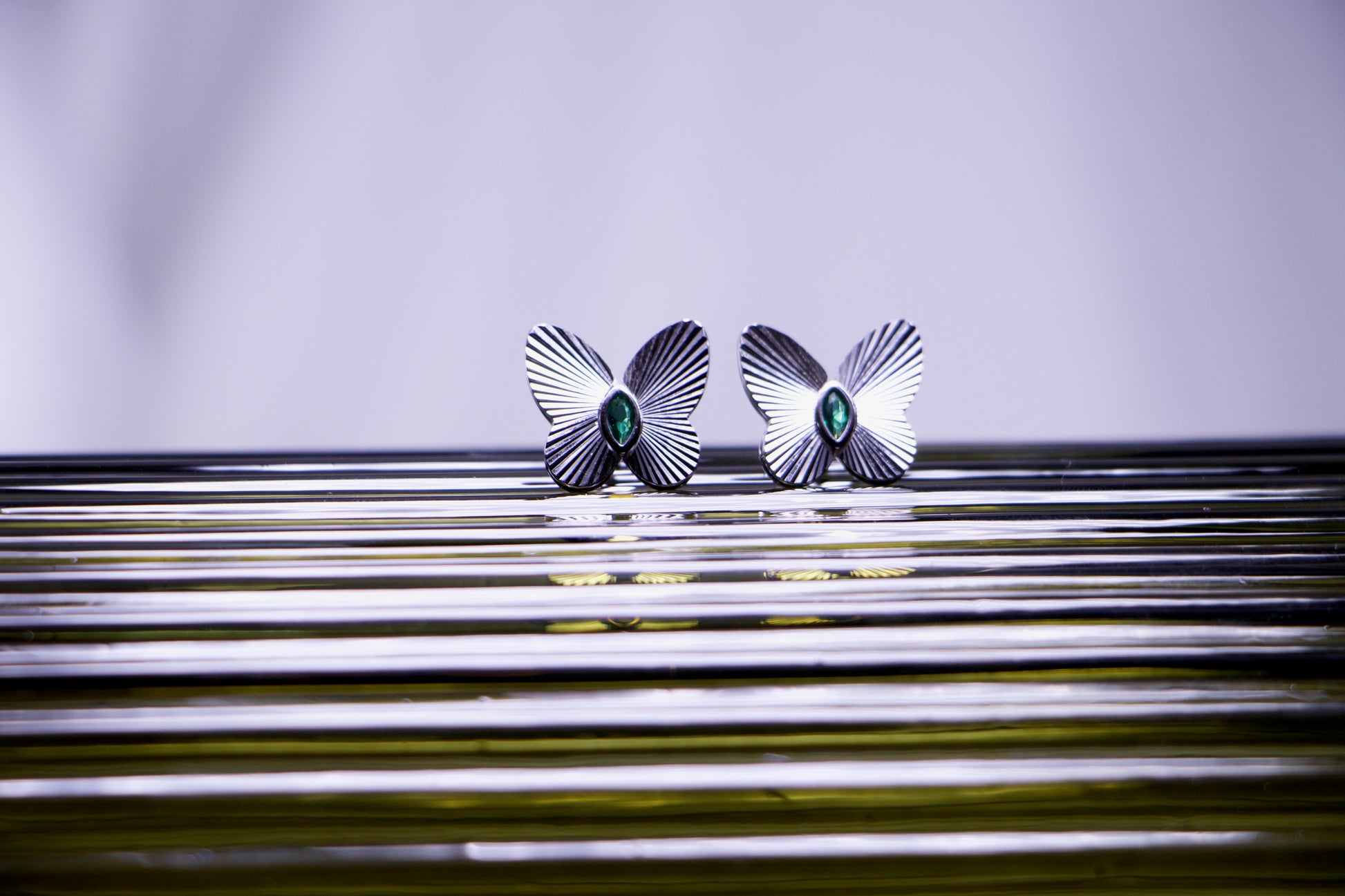 Emerald Accented Butterfly Stud Earrings