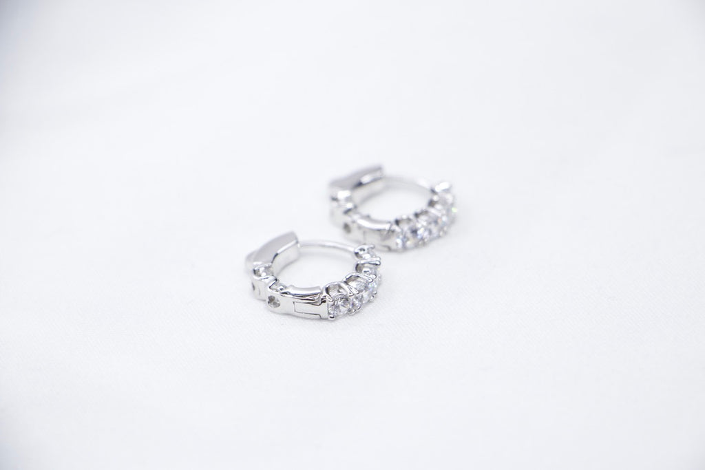White gold diamond hoop earrings, elegant minimalist design, timeless, luxury fine jewelry front other side view.