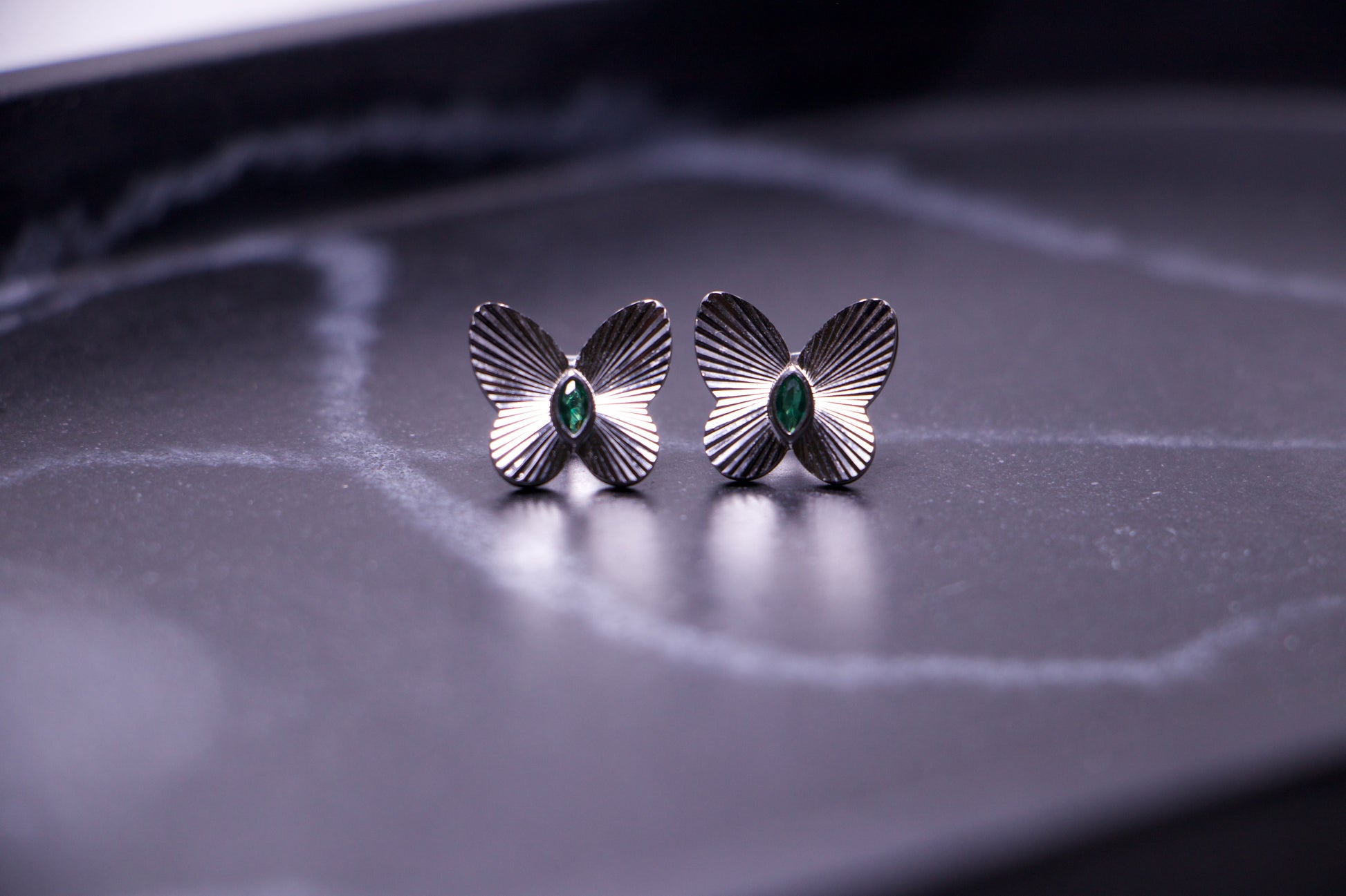 Emerald Accented Butterfly Stud Earrings