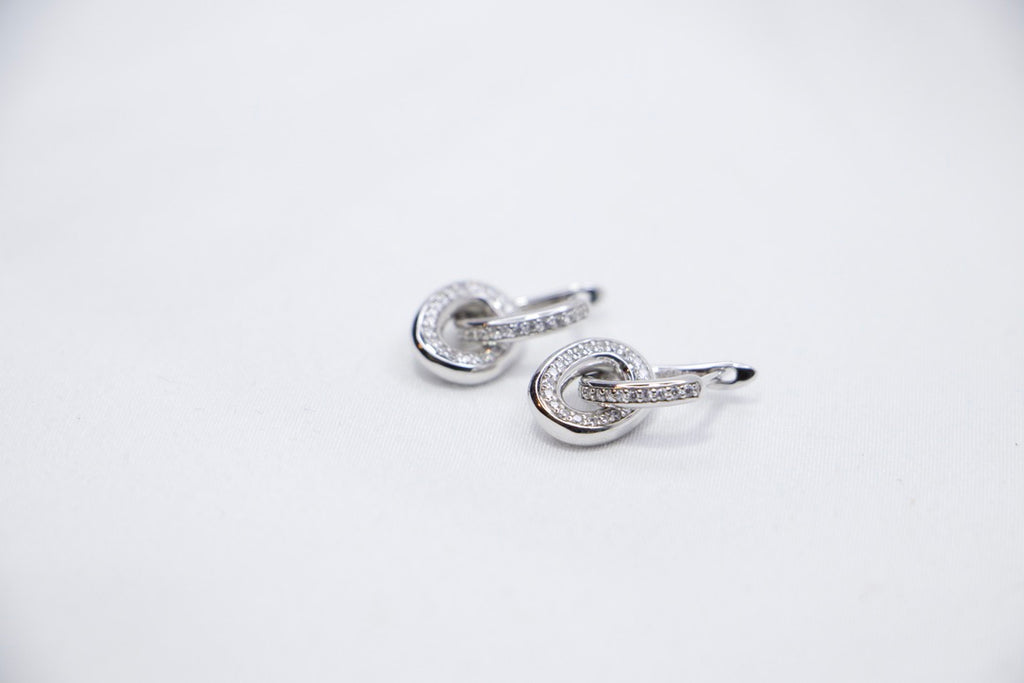Silver Hoop Earrings with Cubic Zirconia with Minimalist Modern Jewelry for Women with top side view.