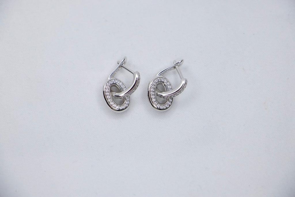 Silver Hoop Earrings with Cubic Zirconia with Minimalist Modern Jewelry for Women top view.