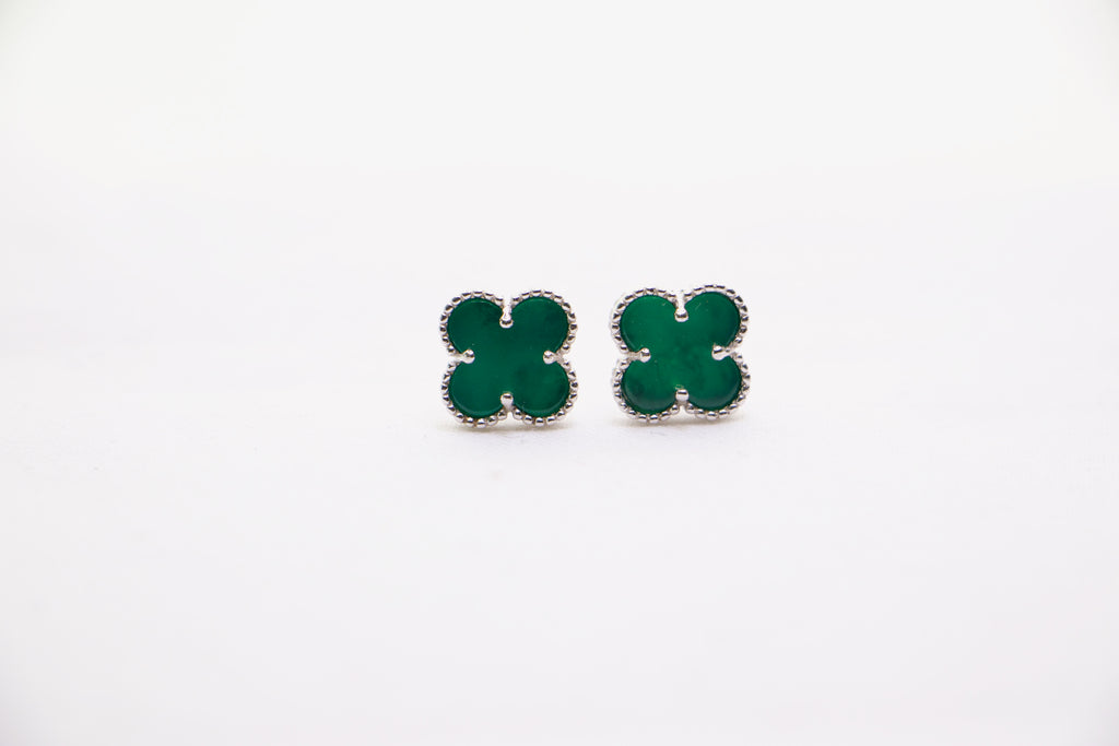 Sterling silver clover earrings with emerald green enamel, hypoallergenic luxury studs for women.
