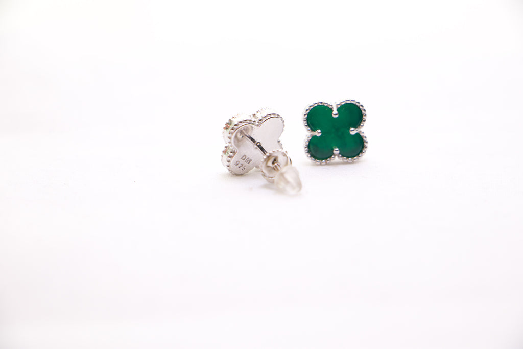 Sterling silver clover earrings with emerald green enamel, hypoallergenic luxury studs for women.