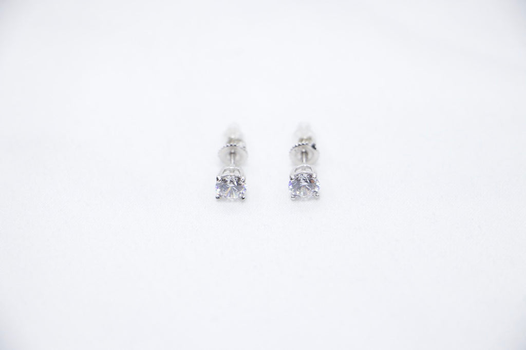 Eternal Glow Stud Earrings featuring square-cut cubic zirconia stones set in sterling silver, a sleek and sparkling design with a secure butterfly-back closure, front top view.