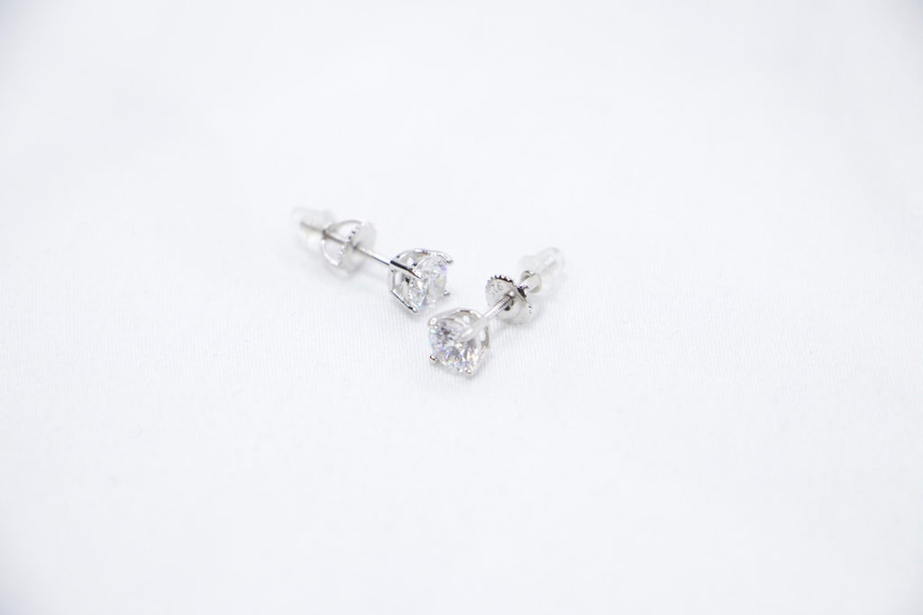 Eternal Glow Stud Earrings featuring square-cut cubic zirconia stones set in sterling silver, a sleek and sparkling design with a secure butterfly-back closure, front sides view.