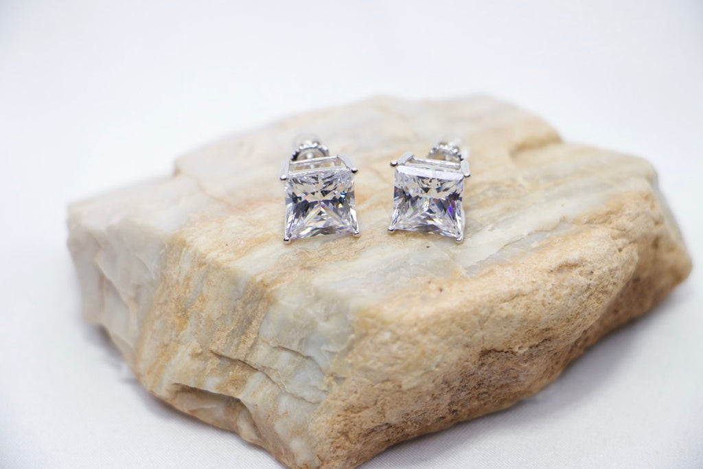 An Eternal Radiance Princess Cut Studs featuring princess-cut cubic zirconia stones set in sterling silver, rock view. 