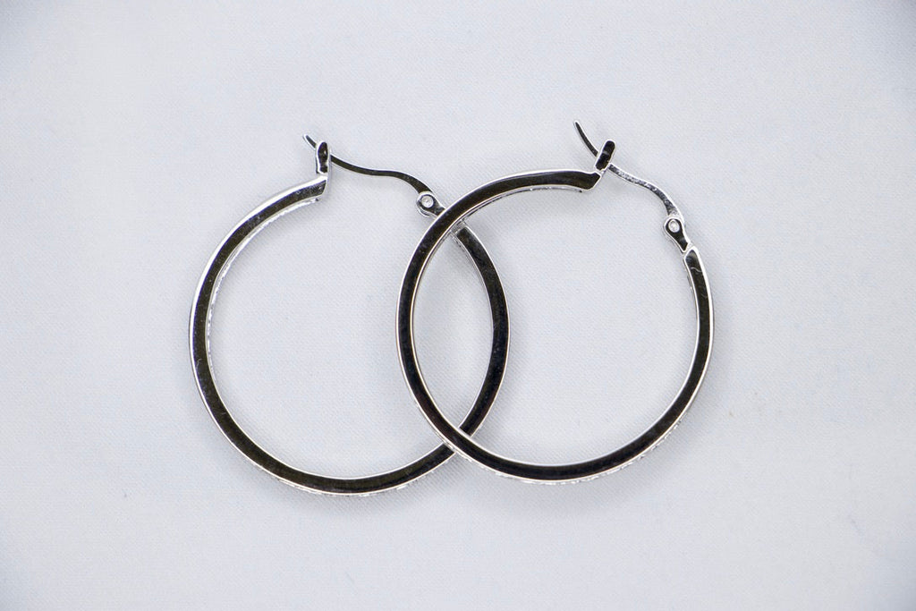 Sterling Silver Hoop Earrings with Cubic Zirconia - Elegant, Hypoallergenic Jewelry for Women top view.