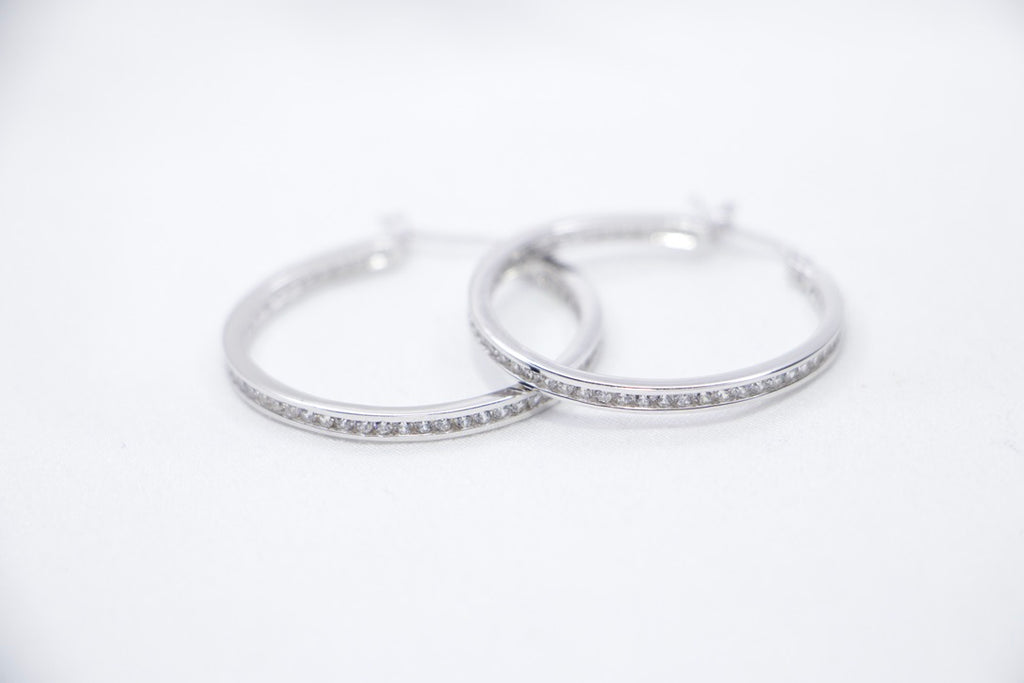 Sterling Silver Hoop Earrings with Cubic Zirconia - Elegant, Hypoallergenic Jewelry for Women front view.