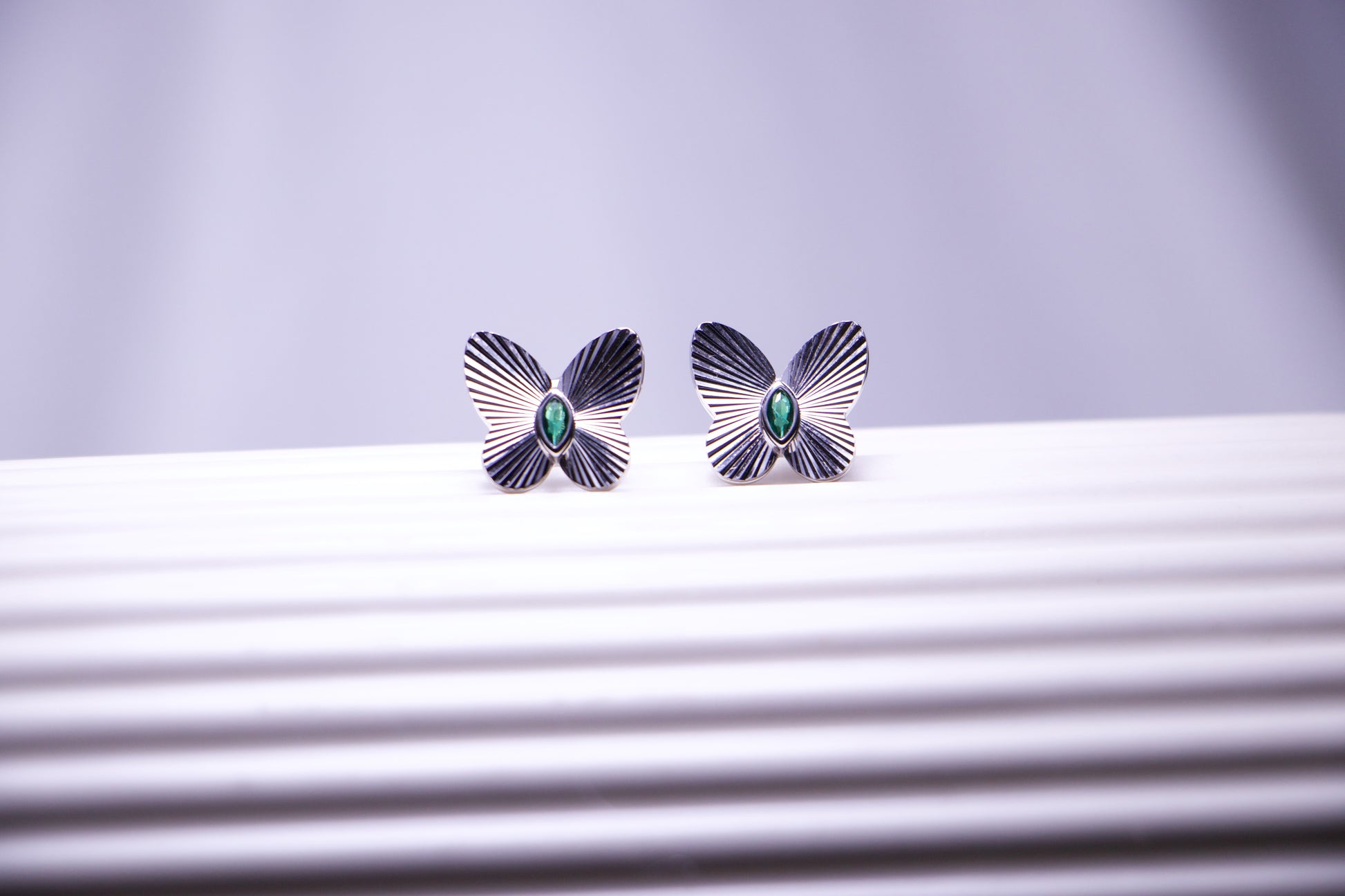 Emerald Accented Butterfly Stud Earrings