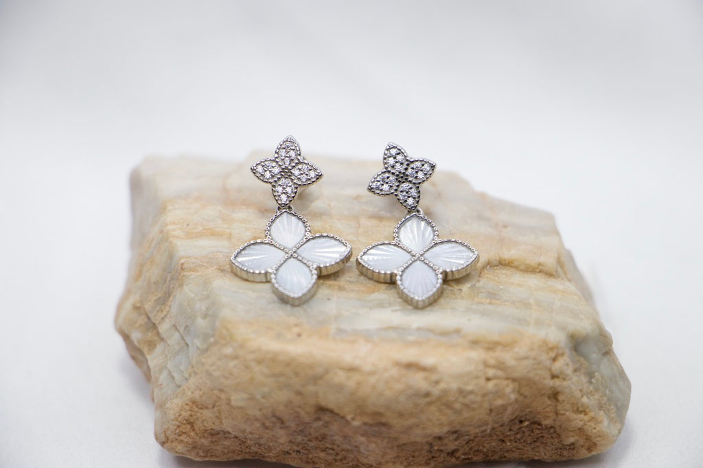 Four-Leaf Clover Drop Earrings with Lucky Charm Jewelry for Women, front rock view.