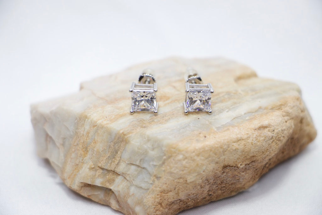 Glamour Square Stud Earrings featuring square-cut cubic zirconia stones set in sterling silver with front rock view.