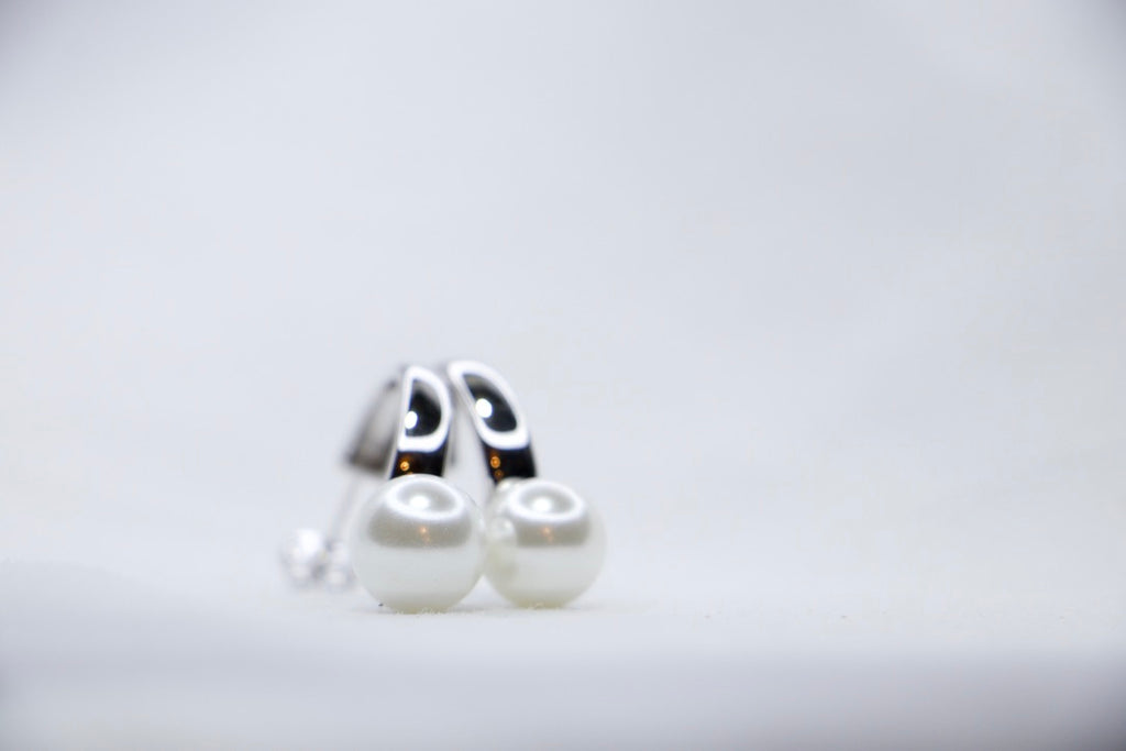 Sterling Silver Pearl Hoop Earrings Elegant but Minimalist Jewelry with Lightweight Hoops front side view. 