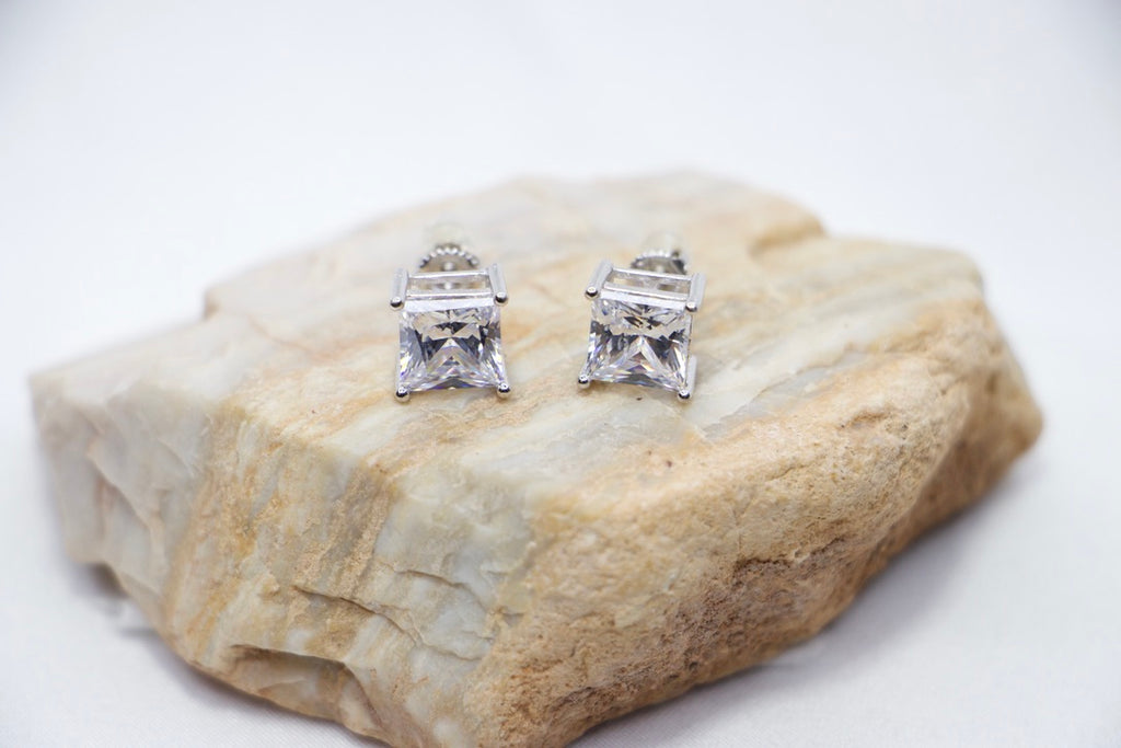 A Modern Sparkle Square Studs featuring square-cut cubic zirconia stones set in sterling silver, front rock view.