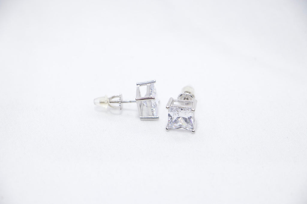 A Modern Sparkle Square Studs featuring square-cut cubic zirconia stones set in sterling silver, side view.