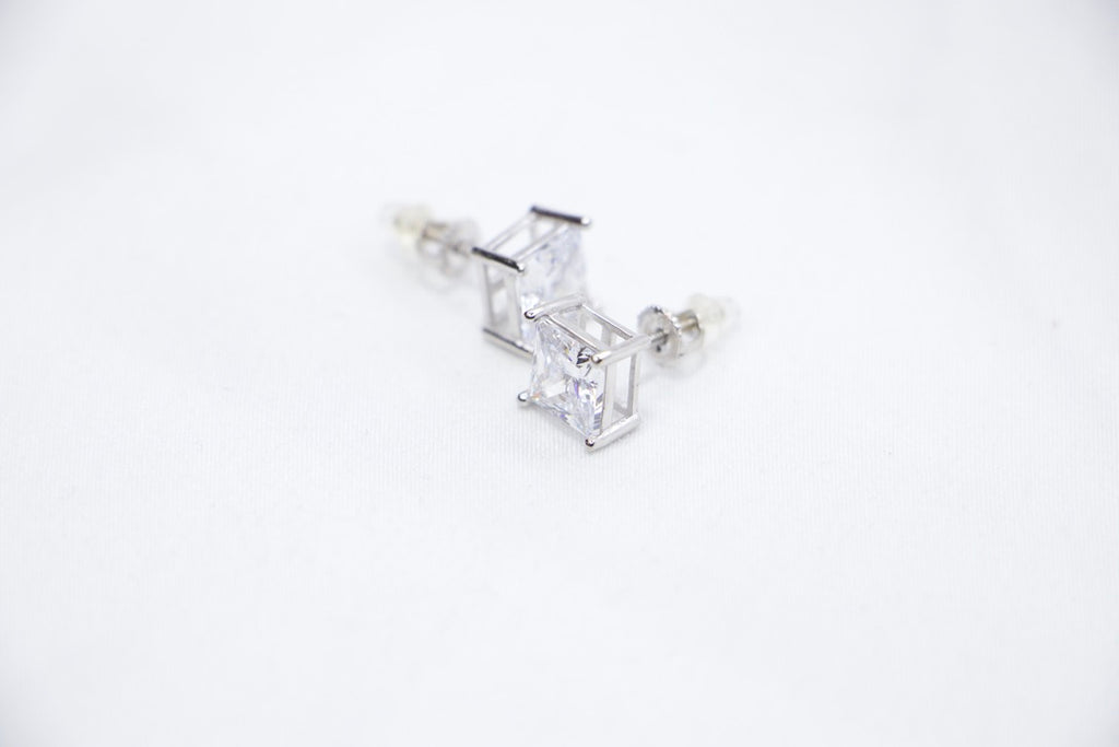 A Modern Sparkle Square Studs featuring square-cut cubic zirconia stones set in sterling silver, front side view.