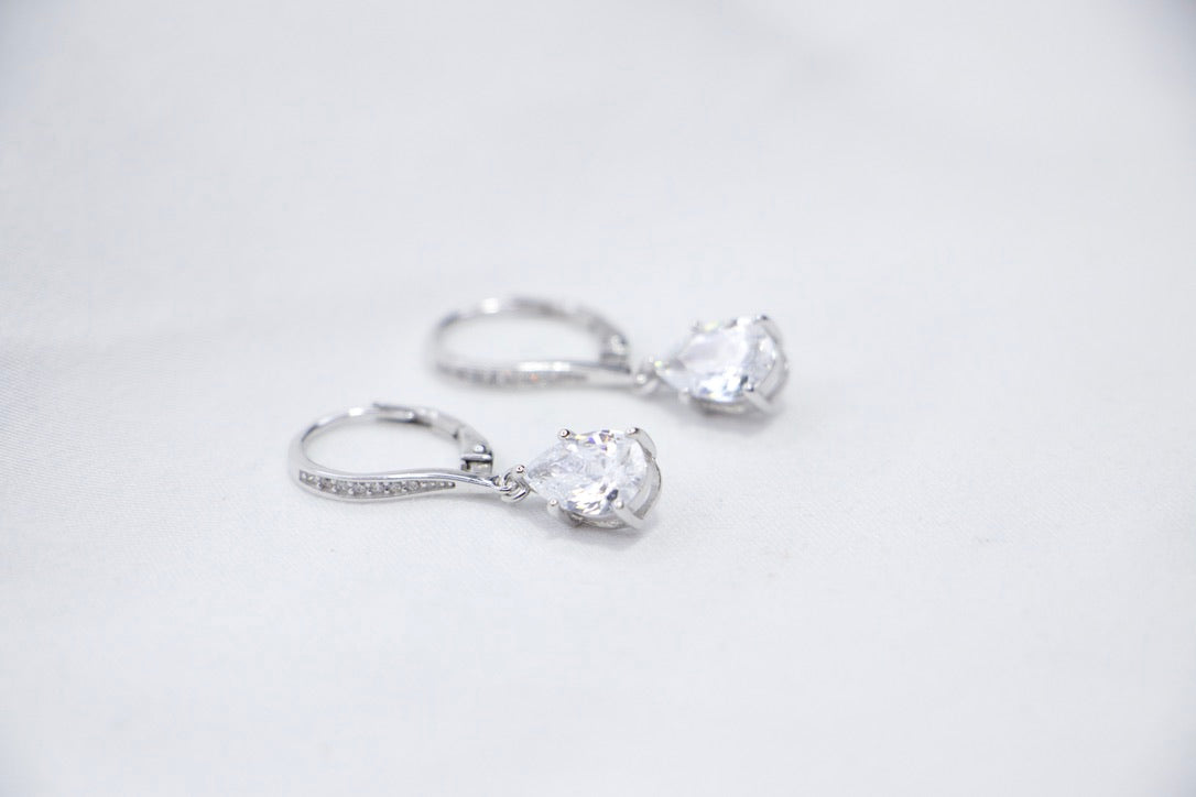 Pear Shaped Dangle Earrings with Cubic Zirconia as Elegant Jewelry for Women, front side view.