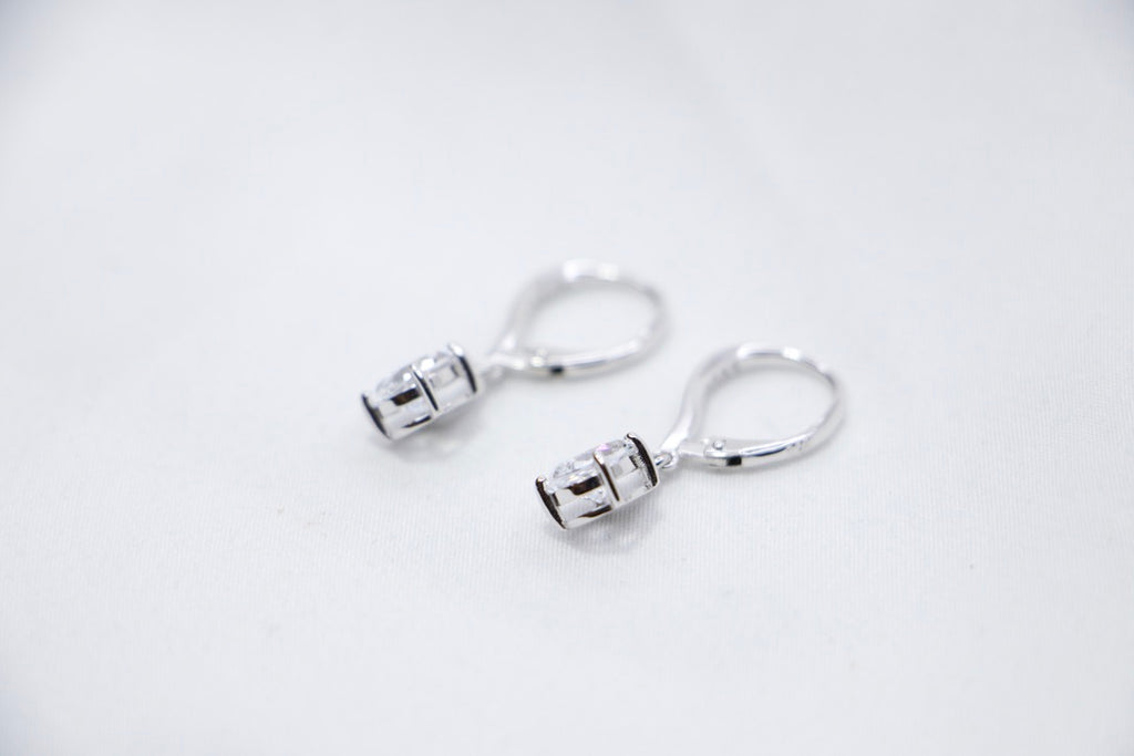 Pear Shaped Dangle Earrings with Cubic Zirconia as Elegant Jewelry for Women, side view.