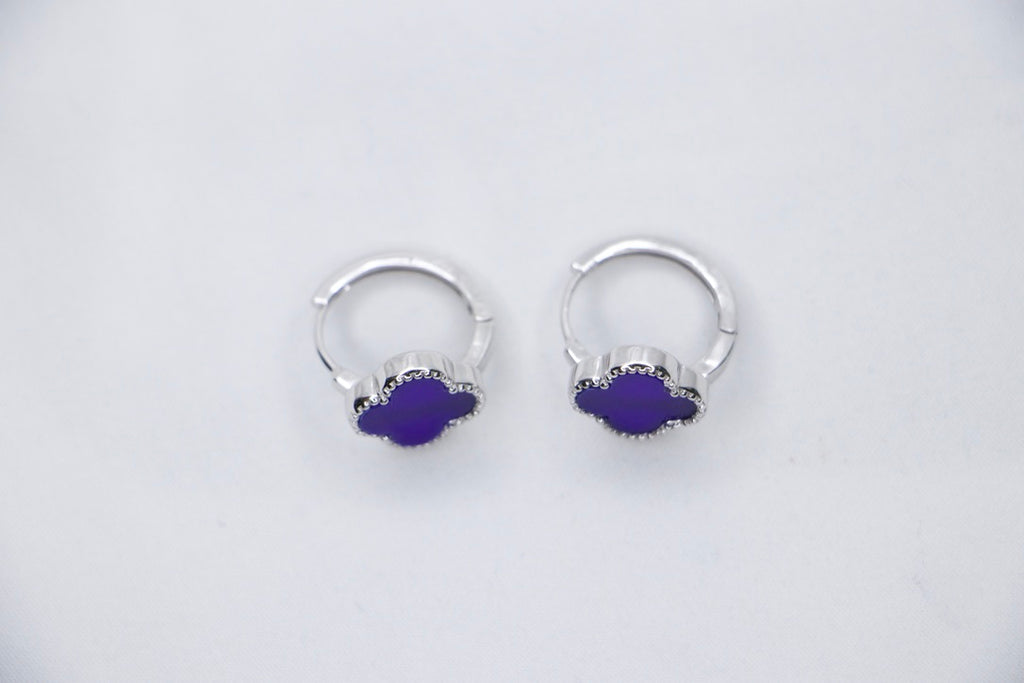 Purple Elegance sterling silver earrings featuring a round purple gemstone surrounded by delicate beaded silver accents top view.
