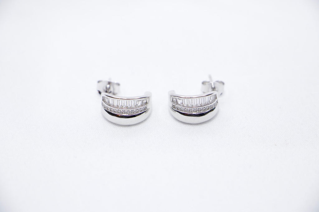 Radiant Allure sterling silver hoop earrings featuring a stunning row of baguette-cut cubic zirconia stones front view.