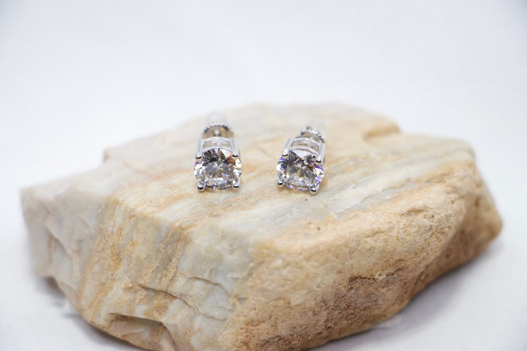 A Radiant Elegance Square Studs featuring a square-cut cubic zirconia set in sterling silver, front rock view.