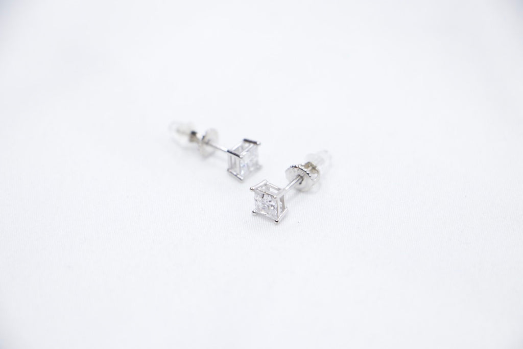 A Radiant Luxe Stud Earrings featuring a rectangular-cut cubic zirconia set in sterling silver, offering a modern and radiant look, sides view.
