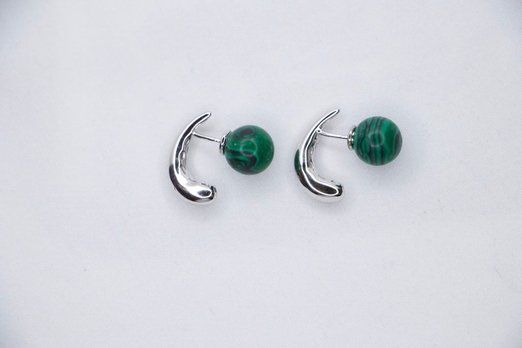 Serpentine Dream Malachite Earrings featuring vibrant green malachite spheres set in a curved side by side view.