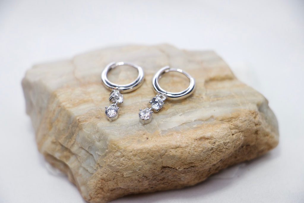 Silver Hoop Earrings with Dangle and Cubic Zirconia with Sparkling Minimalist Jewelry for Women rock view. 