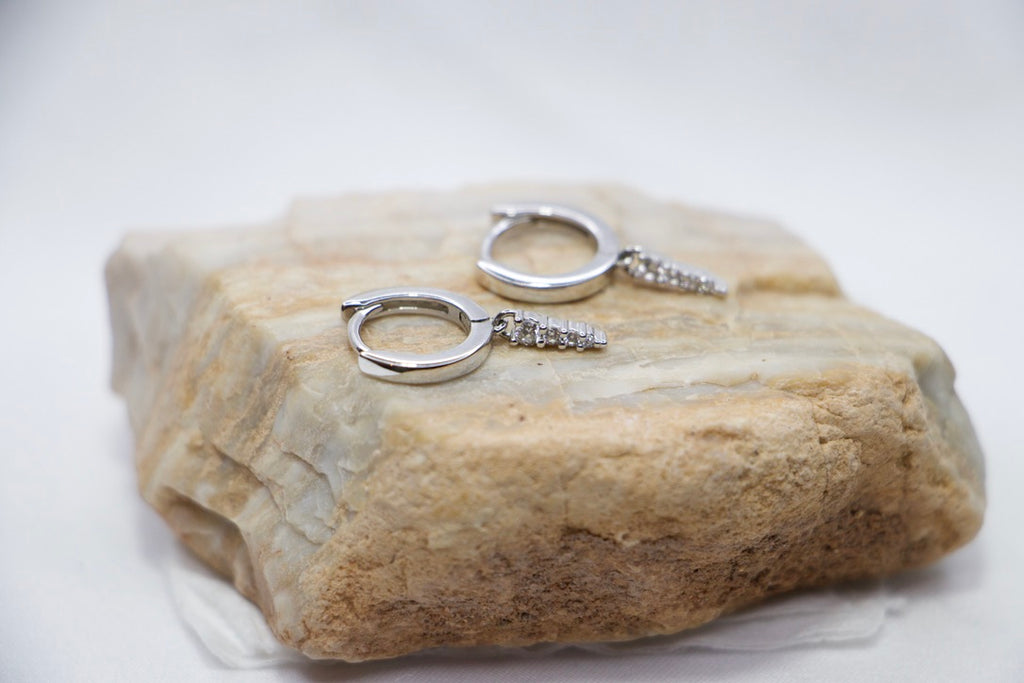 Silver Hoop Earrings with Dangle and Cubic Zirconia - Sparkling Modern Jewelry for Women side rock view.