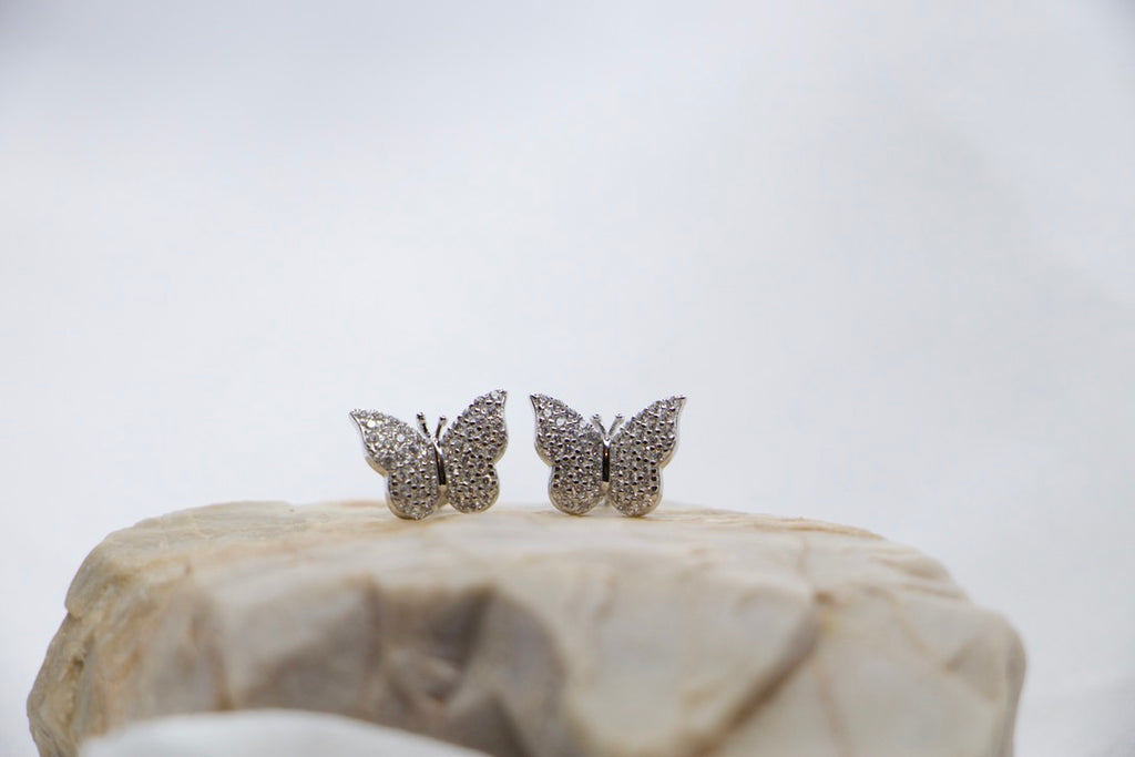 Dazzling Butterfly Stud Earrings with Cubic Zirconia - Fashion Jewelry for Women, front rock view.