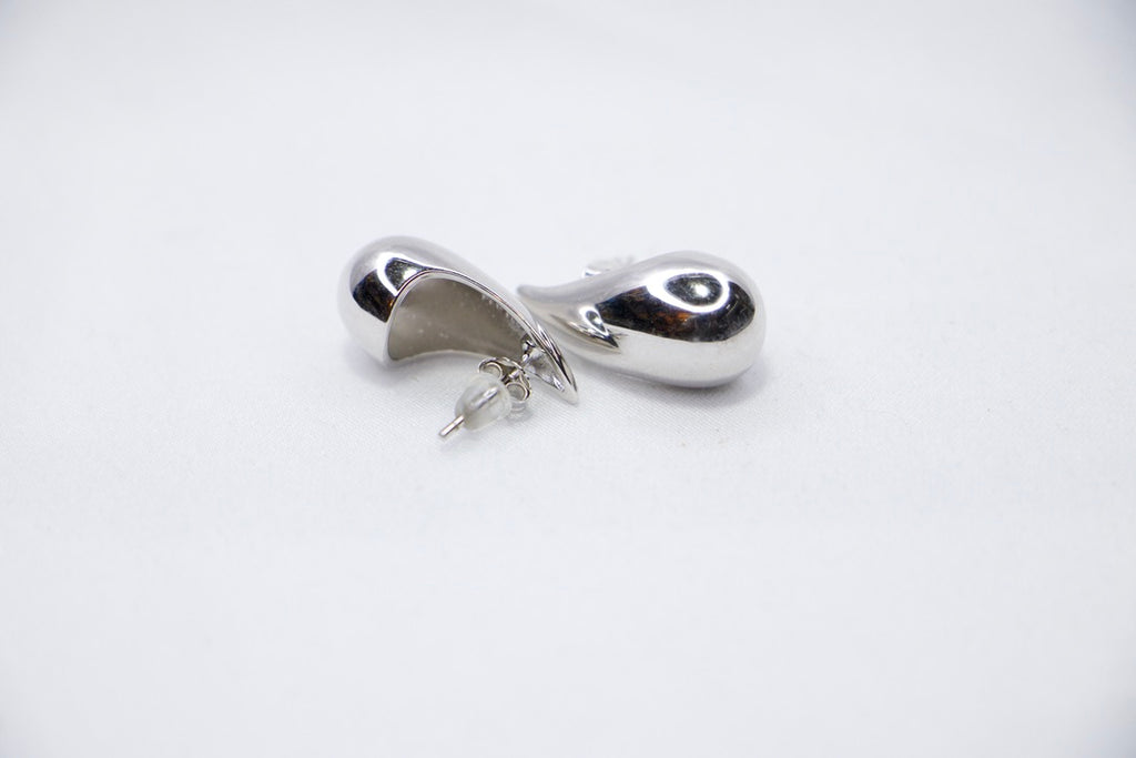 Silver Teardrop Stud Earrings with Minimalist Modern Jewelry for Women, front side view.
