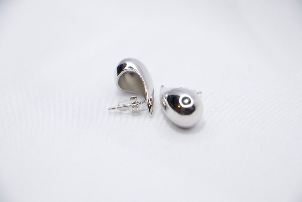Silver Teardrop Stud Earrings with Minimalist Modern Jewelry for Women, sides view.