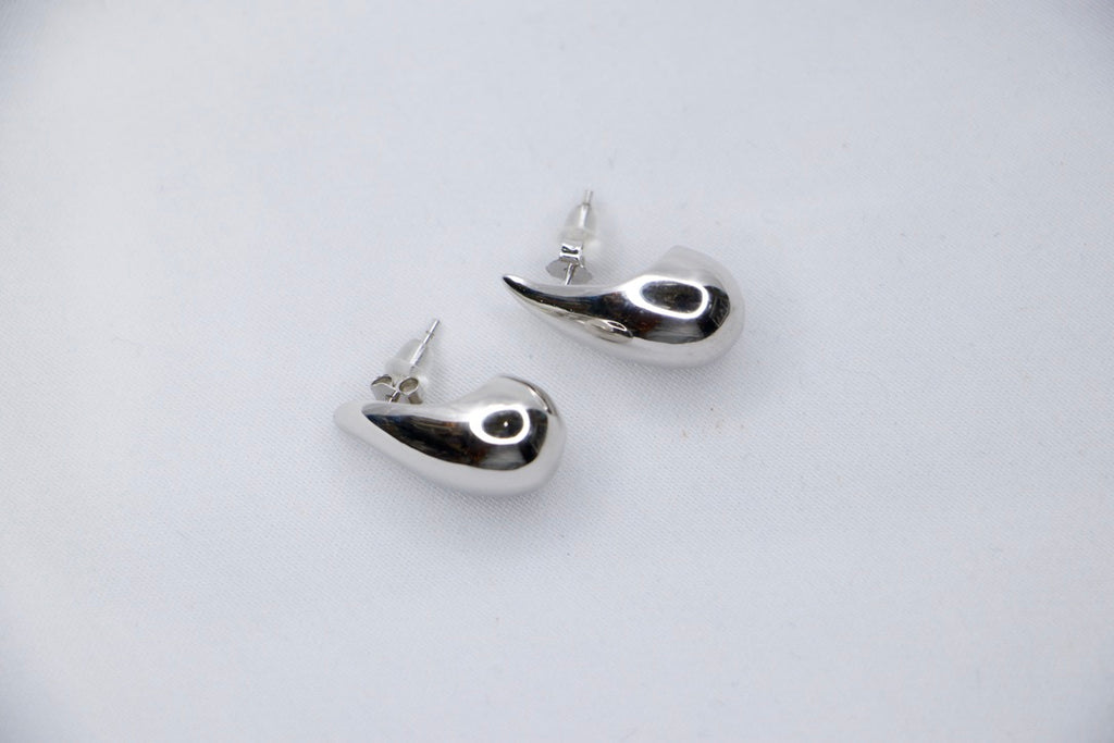 Silver Teardrop Stud Earrings with Minimalist Modern Jewelry for Women, top side view.