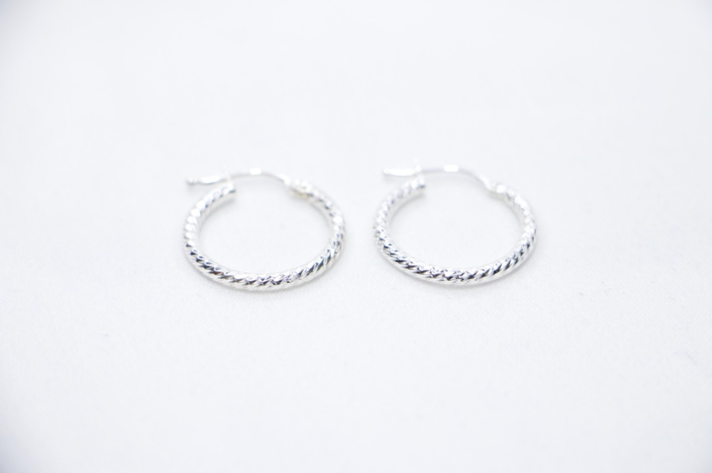 Sterling silver twisted hoop earrings, elegant braided design, lightweight, classic jewelry.